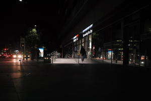 artificial lighting, building, England, eye level view, London, night, pavement, retail, spring, The United Kingdom, urban, walkway