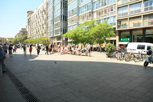 Barcelona, bicycle, Cataluña, day, direct sunlight, eye level view, group, pavement, people, Spain, spring, street, summer, sunny, tree, vegetation