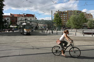 Belgium, Brussels, cycling, day, eye level view, natural light, people, station, street, summer, tramlines, woman