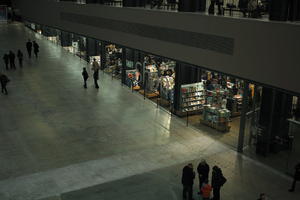 above, artificial lighting, England, group, indoor lighting, indoors, interior, London, pavement, people, retail, shop, shopfronts, standing, The United Kingdom, walking