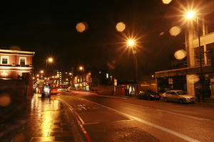 artificial lighting, car, effect, England, eye level view, London, night, street, The United Kingdom, transport