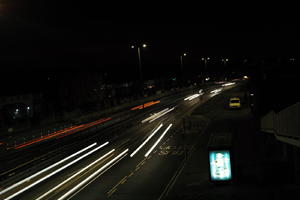 artificial lighting, car, car lights, city lights, elevated, England, evening, London, night, outdoor lighting, road, The United Kingdom, traffic, urban, winter