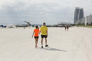 back, beach, couple, day, eye level view, Florida, Miami, people, sporty, summer, sunny, The United States, walking