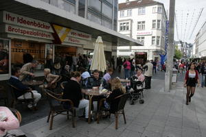 autumn, Bielefeld, bright, cafe, casual, chair, day, Deutschland, eye level view, furniture, Nordrhein-Westfalen, people, shady, sitting, umbrella