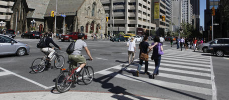 Canada, casual, caucasian, crossing, cycling, day, eye level view, group, Ontario, people, street, summer, sunny, Toronto, walking