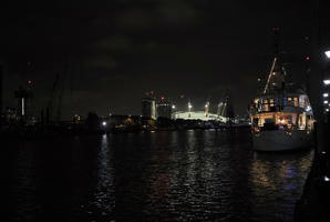 artificial lighting, boat, cityscape, England, eye level view, London, night, reflected, river, The United Kingdom