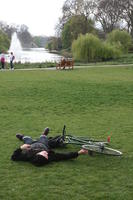 cycling, day, England, eye level view, grass, London, man, park, sitting, spring, The United Kingdom, tree