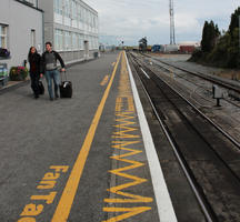 couple, day, diffuse, diffused light, eye level view, front, Ireland, platform, railway, station, summer, walking