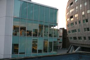 artificial lighting, building, dusk, England, evening, eye level view, facade, glass, London, office, spring, The United Kingdom