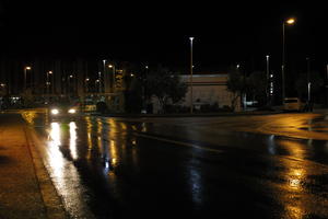 artificial lighting, car, city, Croatia, eye level view, night, spring, street, street light, urban, walkway, wet, Zadar, Zadarska