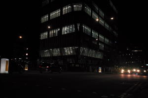 artificial lighting, building, car, city, city lights, England, eye level view, London, night, office building, outdoor lighting, street, The United Kingdom, urban