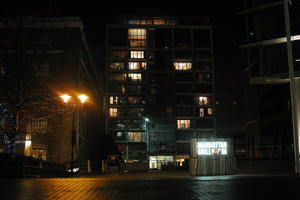 artificial lighting, building, building, England, eye level view, housing block, London, night, residential, street, The United Kingdom, winter