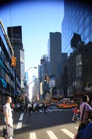 building, business, car, day, eye level view, facade, man, Manhattan, New York, people, skyscraper, standing, street, summer, sunny, taxi, The United States, traffic light, walking