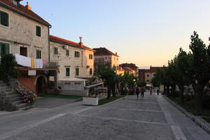 building, Croatia, dusk, evening, eye level view, flower, house, laundry, Makarska, pavement, potted plant, Splitsko-Dalmatinska, steps, tree, vegetation, veranda