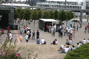 building, casual, day, elevated, England, exhibition, group, London, park, people, sitting, structure, The United Kingdom, tree, walking