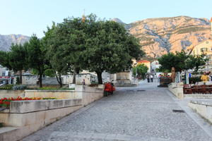 Croatia, day, dusk, eye level view, Makarska, scooter, Splitsko-Dalmatinska, square, street, tree, vegetation