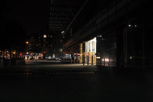 artificial lighting, building, city lights, England, entrance, eye level view, London, night, pavement, spring, The United Kingdom, urban, walkway