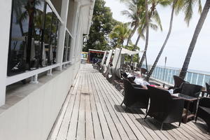 Barbados, cafe, chair, coconut palm, Cocos nucifera, day, decking, eye level view, furniture, hotel, palm, spring, sunbed, sunny, table