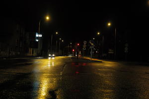 artificial lighting, city lights, eye level view, Kalisz, night, outdoor lighting, Poland, street, urban, wet, Wielkopolskie, winter