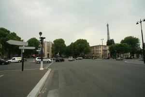 architecture, building, car, day, eye level view, France, Ile-De-France, overcast, Paris, pavement, road, sign, spring, street, traffic light, transport