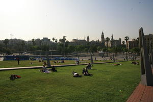 Barcelona, building, Cataluña, church, cityscape, day, eye level view, grass, group, object, palm, park, people, sitting, Spain, square, tourist, tower, tree, vegetation