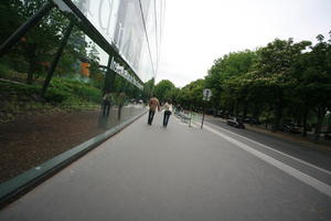 back, couple, day, eye level view, facade, France, glass, Ile-De-France, natural light, Paris, pavement, walking