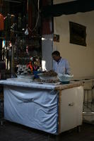 arabic, day, eye level view, food, man, Marrakech, Marrakesh, Morocco, natural light, portrait, stall