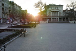 bench, eye level view, pavement, Poland, Poznan, spring, square, sun glare, sunset, Wielkopolskie