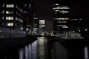 artificial lighting, boat, cityscape, England, eye level view, London, night, reflected, river, The United Kingdom