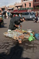 arabic, day, eye level view, food, man, market, Marrakech, Marrakesh, Morocco, natural light, object, stall, sunny