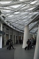 afternoon, below, canopy, column, England, eye level view, indoor lighting, interior, King`s Cross Station, London, natural light, station, structure, terminal, The United Kingdom