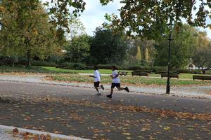 afternoon, autumn, Battersea park, child, day, England, eye level view, group, leaf, London, park, path, running, The United Kingdom, tree