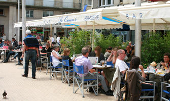 Amiens, bar, cafe, chair, day, eye level view, France, furniture, group, overcast, parasol, people, Picardie, sitting, street, table