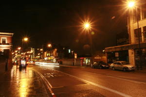 artificial lighting, bus, car, effect, England, eye level view, London, night, street, The United Kingdom, transport