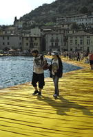 couple, crowd, day, eye level view, Italia , lake, Lombardia, Monte Isola, mountain, platform, summer, sunny, walking