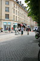 afrocarribean, Amiens, day, eye level view, France, group, man, overcast, pavement, people, Picardie, retail, walking