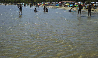 beach, Croatia, day, direct sunlight, eye level view, outdoors, people, standing, summer, sunlight, sunny, sunshine, swimming