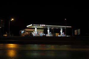 artificial lighting, city lights, eye level view, Kalisz, night, outdoor lighting, petrol station, Poland, street, urban, wet, Wielkopolskie, winter