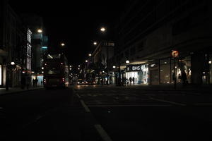 artificial lighting, city lights, England, eye level view, London, night, outdoor lighting, retail, shop, street, The United Kingdom