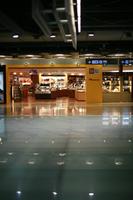 airport, artificial lighting, autumn, Barajas Airport, evening, eye level view, floor, indoor lighting, interior, Madrid, retail, Spain