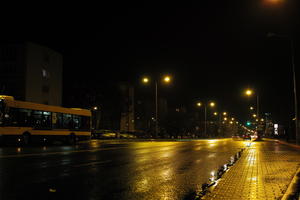 artificial lighting, city lights, eye level view, Kalisz, night, outdoor lighting, pavement, Poland, street, urban, wet, Wielkopolskie, winter