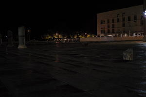 artificial lighting, building, city, Croatia, eye level view, night, pavement, pavement, paving, plaza, ruin, spring, wet, Zadar, Zadarska