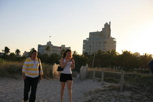 beach, dusk, eye level view, Florida, Miami, palm, summer, The United States, vegetation, walking, winter, woman