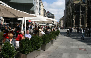 Austria, bush, casual, day, direct sunlight, eye level view, natural light, parasol, people, plant, plaza, sitting, square, standing, summer, sunlight, sunny, sunshine, terrace, Vienna, Wien