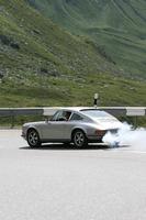 car, day, eye level view, mountain, natural light, road, Switzerland, Switzerland, vegetation