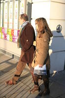 afternoon, couple, day, England, eye level view, London, natural light, people, side, street, The United Kingdom, walking, winter, winter, woman