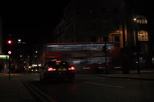 artificial lighting, car, car lights, city lights, England, eye level view, London, night, spring, street, The United Kingdom, urban