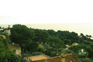 afternoon, cliffs, cloudy, day, elevated, garden, looking down, Monaco, Monte Carlo, Monte-Carlo, museum, overcast, roofscape, seascape, sun glare, top-down perspective, tree, tree canopy, treeline, winter