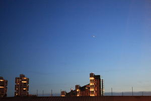 airplane, artificial lighting, clear, England, evening, eye level view, London, sky, The United Kingdom, transport