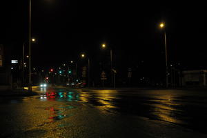 artificial lighting, city lights, eye level view, Kalisz, lowered, night, outdoor lighting, Poland, street, urban, wet, Wielkopolskie, winter